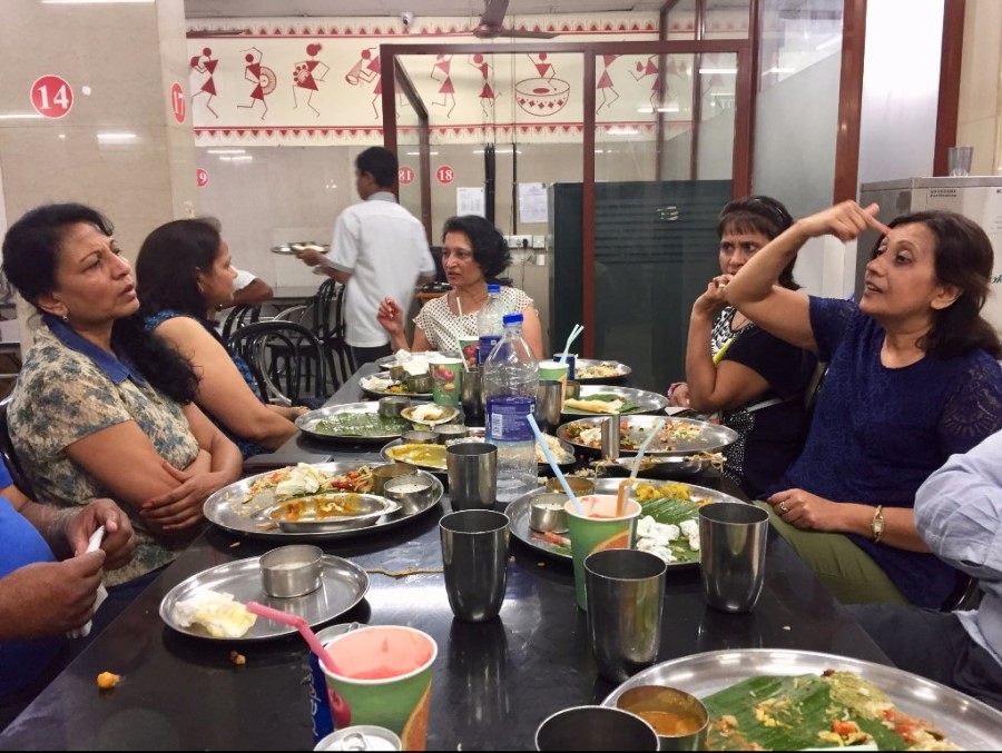 Guests being served a traditional sadya at Ambiswamy's